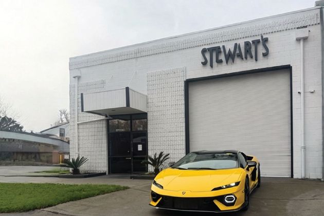 Yellow Lamborghini sports car parked outside